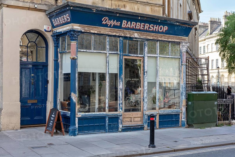 A traditional barbershop in an old shop front in the city, Bath