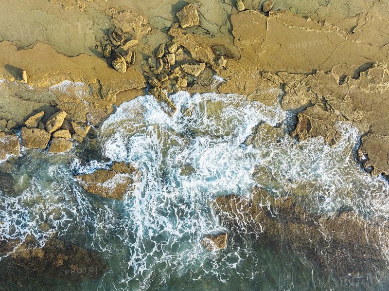 Breakers at the shore of the Atlantic Ocean near Cape Trafalgar. Aerial view. Drone shot. Costa de la Luz, Cádiz province, Andalusia, Spain, Europe