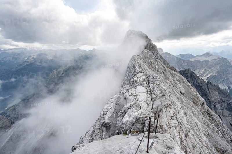 Clouds around a narrow rocky ridge, Watzmann crossing to Watzmann Mittelspitze, view of mountain panorama, Berchtesgaden National Park, Berchtesgaden Alps, Bavaria, Germany, Europe