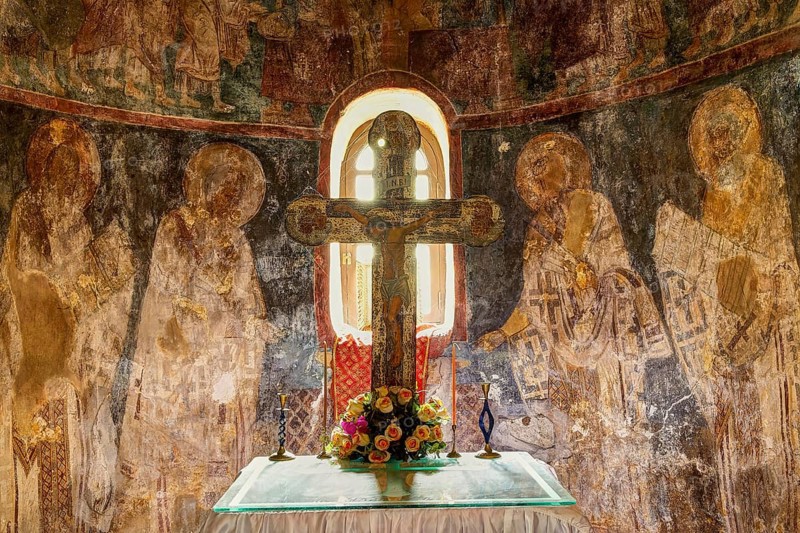 HDR, View of an altar with a cross, flowers and religious wall paintings in the background, chancel, Byzantine Chapel Agios Nikolaos Foundoukli, between Eleousa and Profitis Ilias, Rhodes, Dodecanese, Greek Islands, Greece, Europe