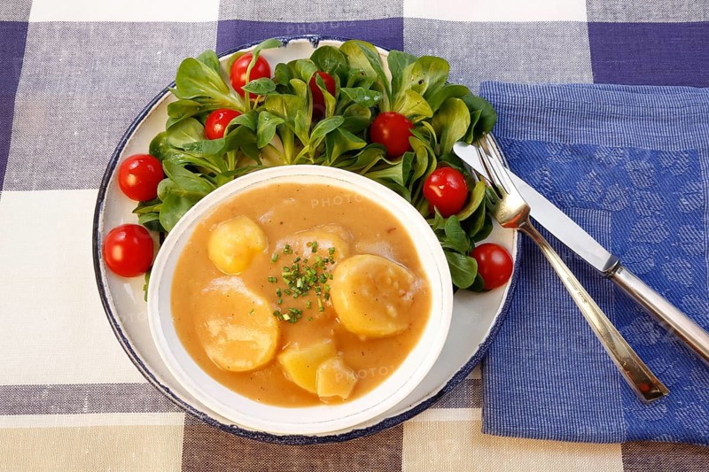 Swabian cuisine, sour potato wheels, potato slices in sour sauce, healthy cuisine, typical Swabian, home cooking, traditional cuisine, food photography, studio