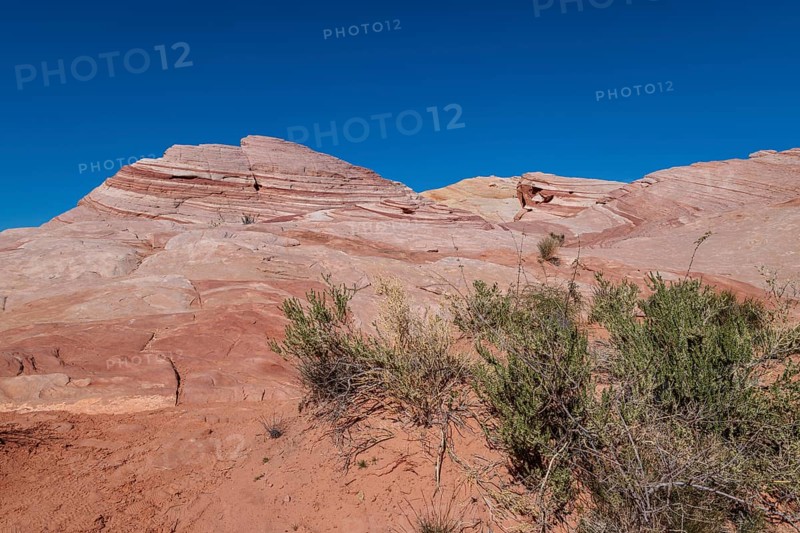 Layered rock formations along the Fire Wave Trail at Valley of Fire State Park near Overton, Nevada