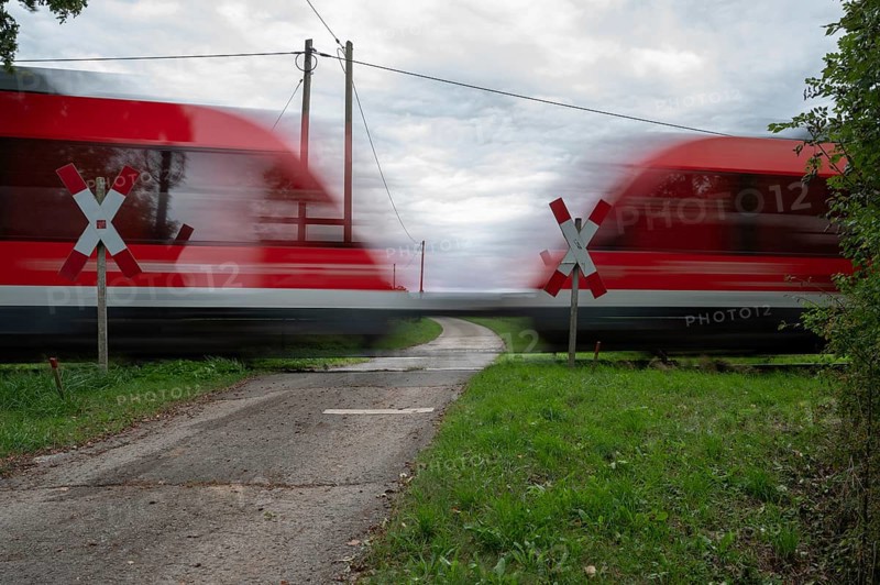 Passing Gräfenberg railway, single-track branch line, at the unrestricted level crossing, Igensdorf, Upper Franconia, Bavaria, Germany, Europe
