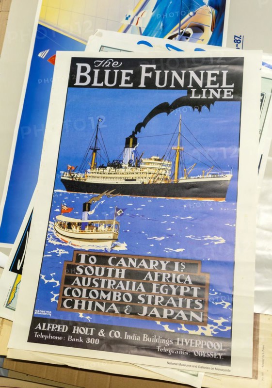 Pile of vintage posters on sale at auction, The Blue Funnel Line shipping company reproduction poster