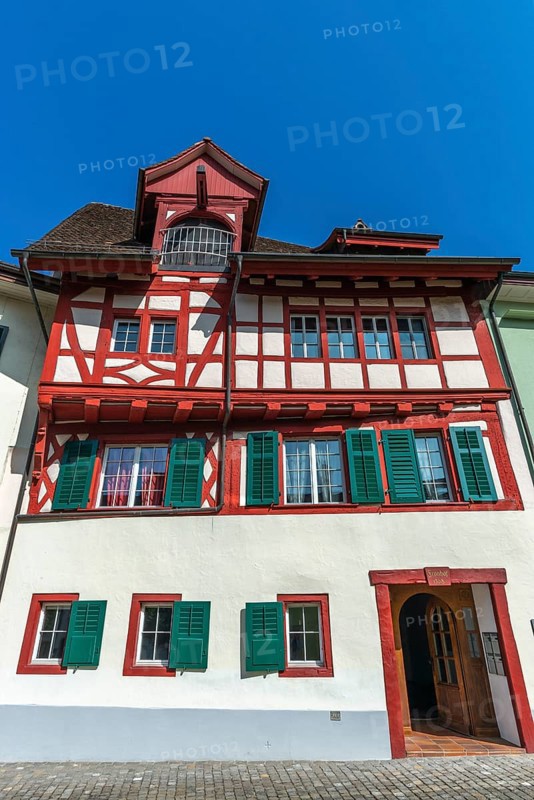 Historic street, Fronhof, Stein am Rhein, half-timbered house Fronhof, shutters, gate entrance, lorry crane, Canton Schaffhausen, Switzerland, Europe