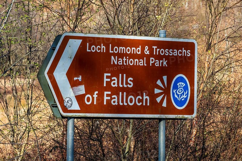 Signpost, waterfall Falls of Falloch, Loch Lomond NP, Scotland, UK