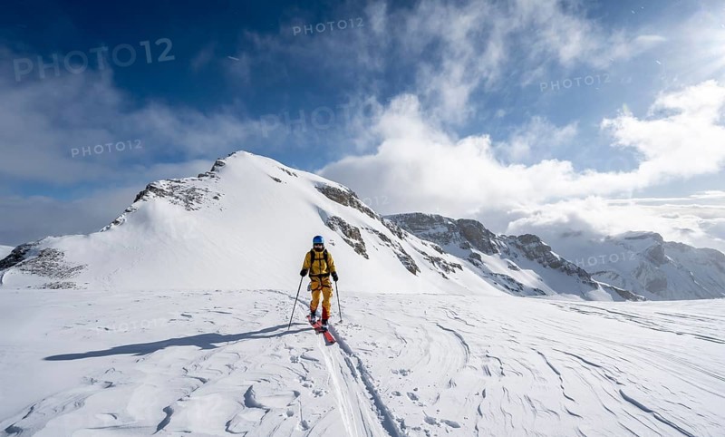 Ski tourers in a snowy mountain landscape, ascent to the Wildhorn, cloudy mood, high tour, Bernese Alps, Bernese Oberland, Switzerland, Europe