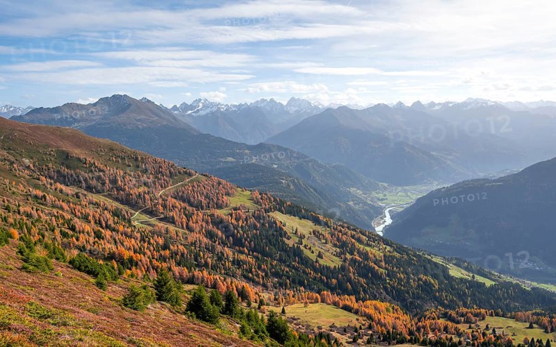 View of the mountain panorama and the Upper Inn Valley in the morning light, Krahberg on the Venet in autumn with yellow larches, Ötztal Alps, Tyrol, Austria, Europe