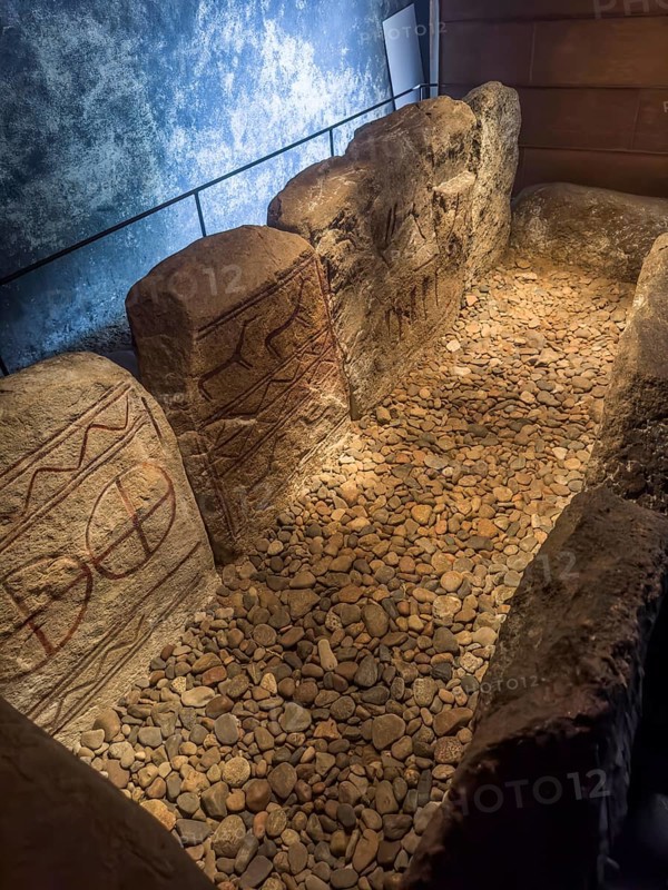 Carved figures in stone slabs inside the King's Tomb, a Bronze Age tomb in Kivik, Simrishamn Municipality, Skåne County, Sweden, Scandinavia, Europe