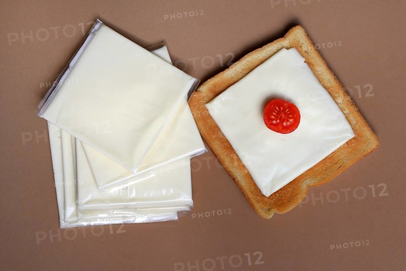 Cheese slices with toast, processed cheese in packaging