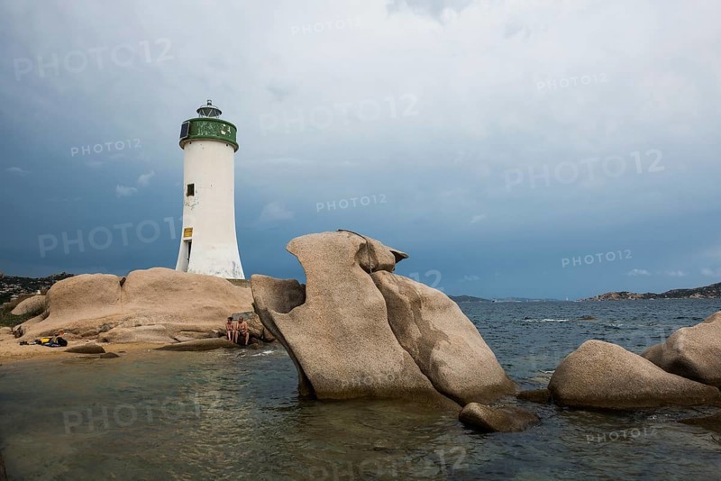 Lighthouse with beach and bizarre granite rocks, Spiaggia Porto Faro, Faro di Punta Palau, Palau, Costa Smeralda, Sardinia, Italy, Oceania