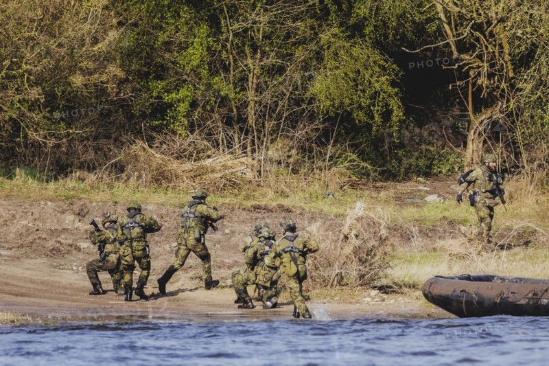 Czech and German soldiers launch an inflatable boat into the Elbe as part of the military exercise 'Wettiner Schwert' near Tangermünde, 26 March 2024. 'Wettiner Schwert' is part of the NATO Quadriga exercise