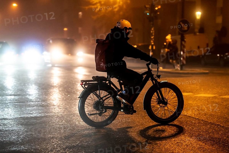 Cyclist, darkness, inner city traffic, fog, autumn, winter, evening traffic, North Rhine-Westphalia, Germany, Europe