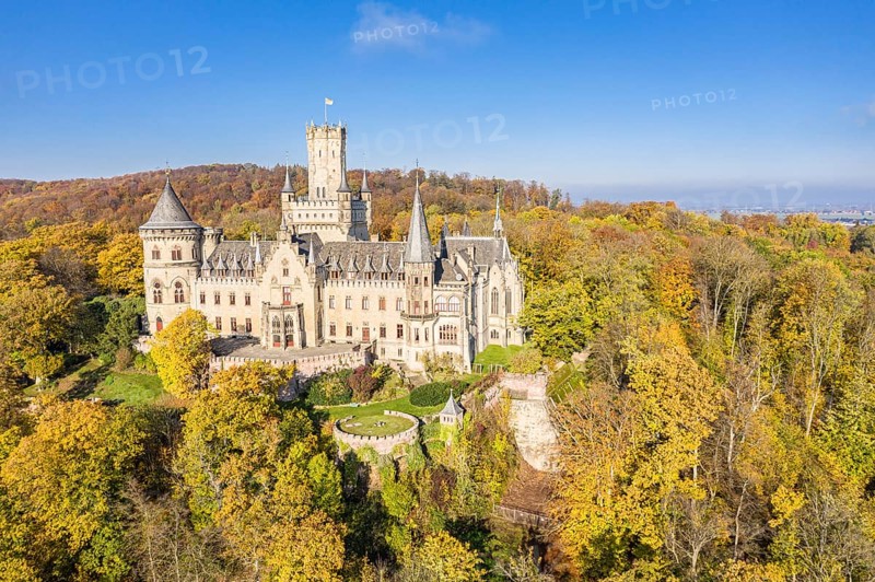 Drone shot of Castle Marienburg south from Hannover, on Mt Marienberg above river Leine, autumnal foliage, Germany, Europe