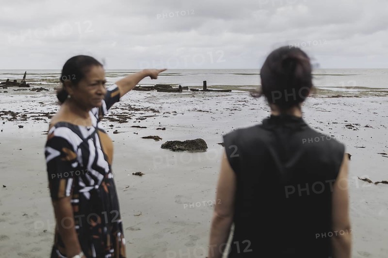 (L-R) Christine Fung, employee of the Deutsche Gesellschaft für Internationale Zusammenarbeit, and Annalena Bärbock (Bündnis 90/Die Grünen), Federal Foreign Minister, photographed during a briefing on coastal erosion at a cemetery near the settlement of Togoru flooded by rising sea levels, 07.05.2024. Bärbock is travelling to Australia, New Zealand and Fiji for political talks / Photographed on behalf of the Federal Foreign Office