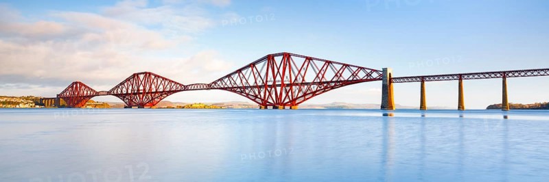 View of the red railway bridge Forth Bridge at the Fírth of Forth estuary near South Queensferry, Scotland, Great Britain