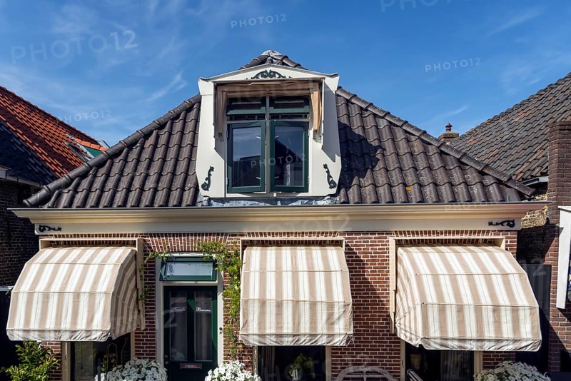 Typical Dutch house, awnings, sun protection, living, house, architecture, history, tourism, lambs, Netherlands