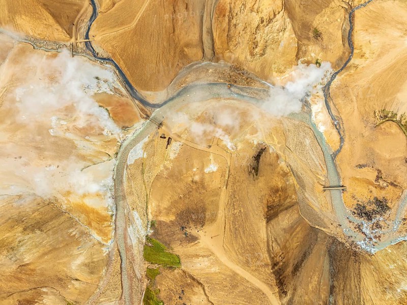 Steaming hot springs and colourful rhyolite mountains, aerial view, Hveradalir geothermal area, Kerlingarfjöll, Icelandic highlands, Iceland, Europe