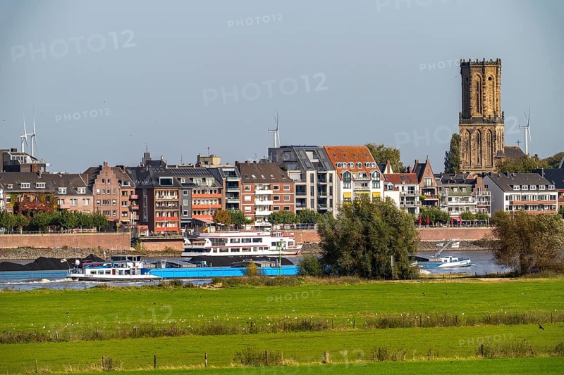 Skyline of Emmerich, on the Lower Rhine, left bank of the Rhine, cargo ship, St. Aldegundis Church, North Rhine-Westphalia, Germany, Europe