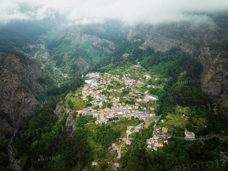 Aerial drone view of Curral das Freiras village in Valley of the Nuns from Miradouro da Eira do Serrado, Madeira island, Portugal, Europe