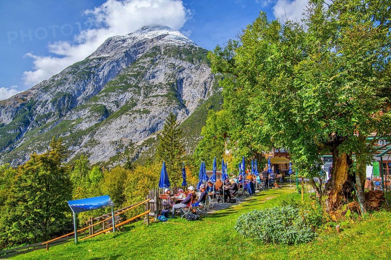 Restaurant terrace of the Landgasthof Ropferstubn above the Inn Valley in front of the Hohe Munde 2662m, Telfs-Buchen near Seefeld, Tyrol, Austria, Europe