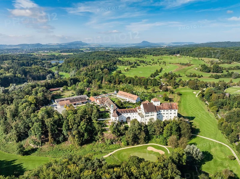 Aerial view of Langenstein Castle near Eigeltingen with surrounding golf course, the Hegau Mountains on the horizon, district of Constance, Baden-Württemberg, Germany, Europe
