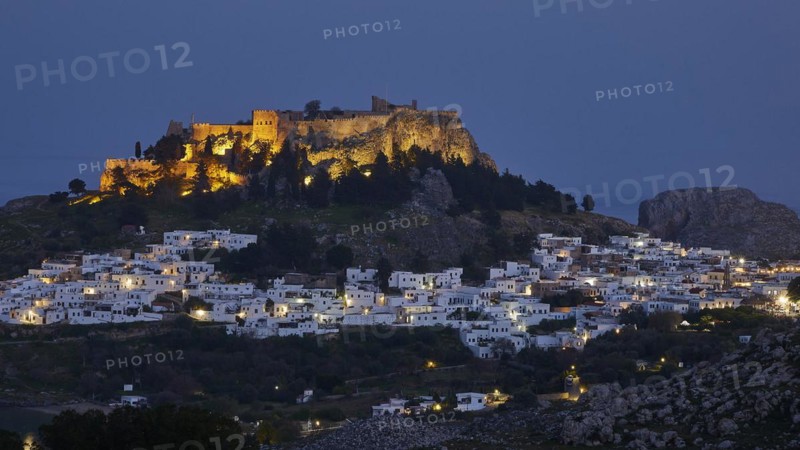 Evening light, Artificial lighting, Acropolis and St John's Fortress of Lindos, Lindos village, Rhodes, Dodecanese, Greek Islands, Greece, Europe