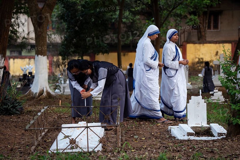 Nuns offer prayers on the grave during the All souls day observation, in Guwahati, India on 2 November 2024. All Souls' Day is a Christian holiday dedicated to honoring and praying for the souls of the departed