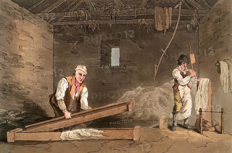 Scene from everyday life in England around 1810, textile worker. One man is breaking a cord with a swape, on the right another is swinging it by chopping it with a wooden axe, Historical, digitally restored reproduction from a 19th century original, date unknown