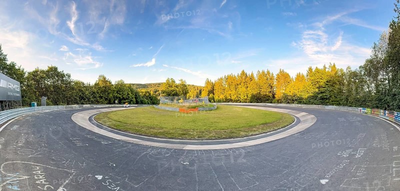 Panoramic photo of track section Caracciola-Karussell on international official race track for motorsport 24h race Nürburgring race track Nordschleife Green Hell Green Hell former historic Formula 1 track originally country roads in low mountain range Eifel, Nürburg, Rhineland-Palatinate, Germany, Europe