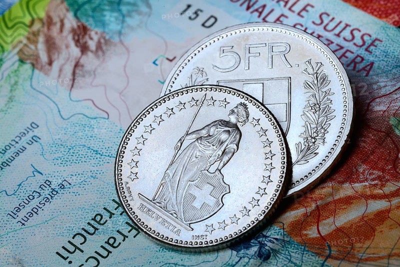 Swiss coins on banknotes, Switzerland, Europe