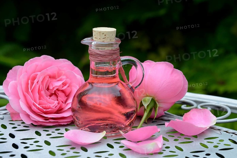 Rose blossom foam bath and rose blossoms, wellness