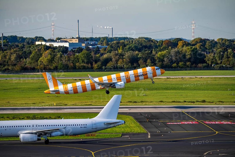 Düsseldorf Airport, North Rhine-Westphalia, Condor Airbus A321-200 on take-off, Aviation Express Malta Airbus A320-200 on the taxiway