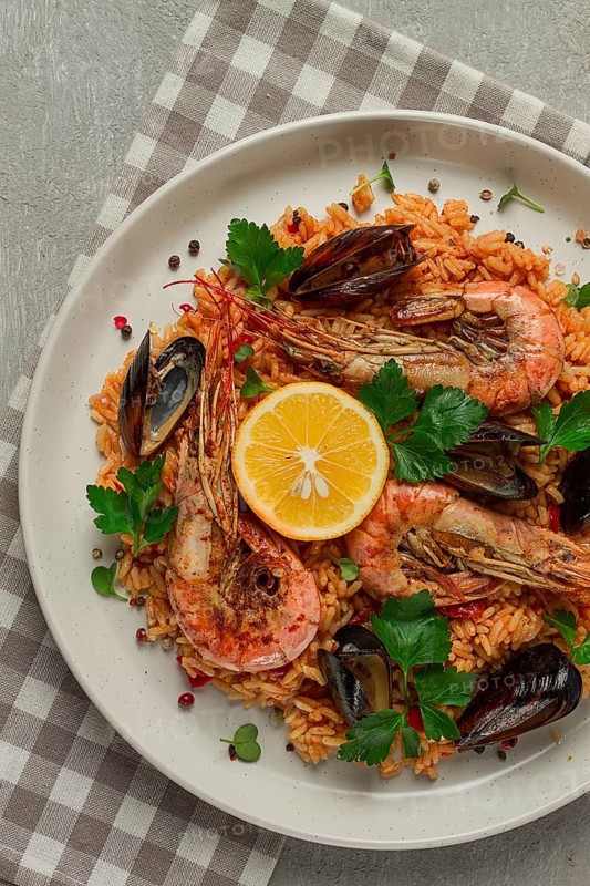 Seafood paella, shrimp and mussels risotto, rice, homemade, top view, no people