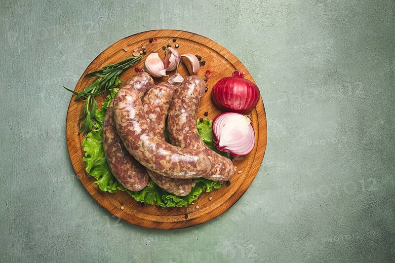 Raw kupaty, traditional Georgian sausages, raw sausages, with spices and herbs, Georgian cuisine