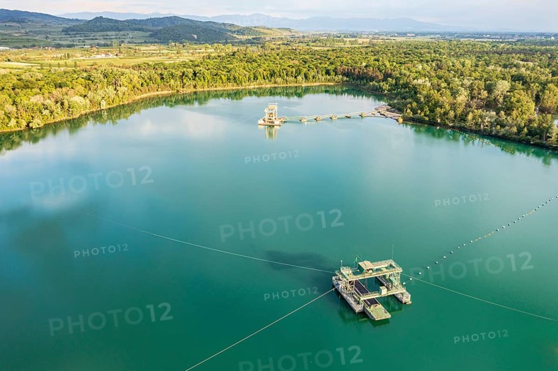 Aerial view of turquoise quarry pond of a gravel pit, Burkheim, Rhine valley, Germany, Europe