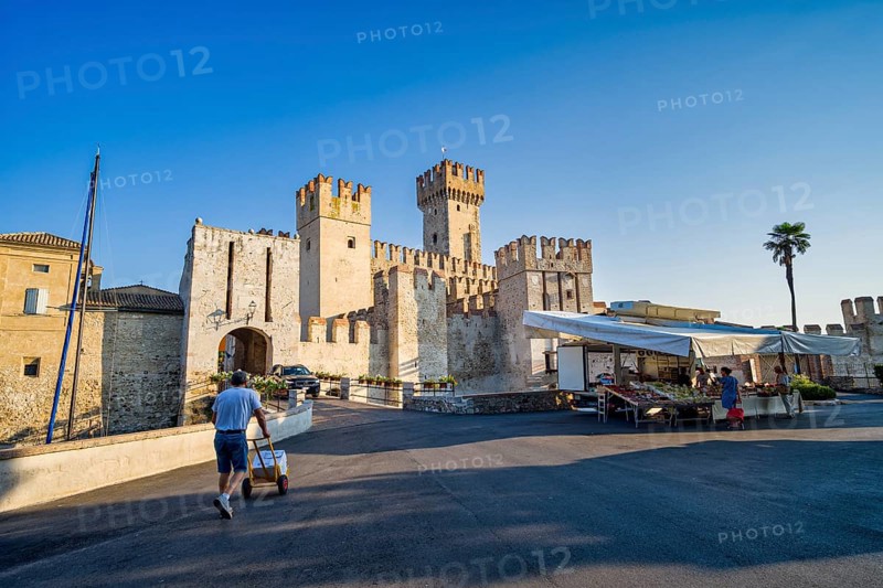 Market stall in front of Castello Scaligero, Sirmione, Lombardy, Italy, Europe
