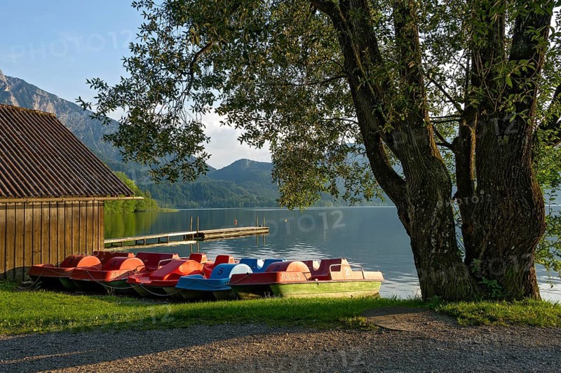 Pedal boats on the jetty in the evening light, boat hire, lakeside promenade of Kochel am See, Lake Kochel, Bavarian Alpine foothills, Alps, Upper Bavaria, Bavaria, Germany, Europe