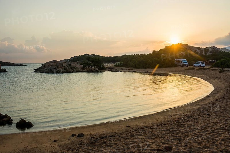 Lonely beach with granite rocks and campers, wild campsite, sunrise, Spiaggia Poltu Manzu, Capo Ceraso, near Olbia, Sardinia, Italy, Europe