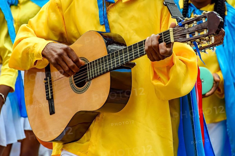 Guitarist playing his instrument during a popular religious festival in the state of Minas Gerais, Belo horizonte, Minas Gerais, Brazil, South America