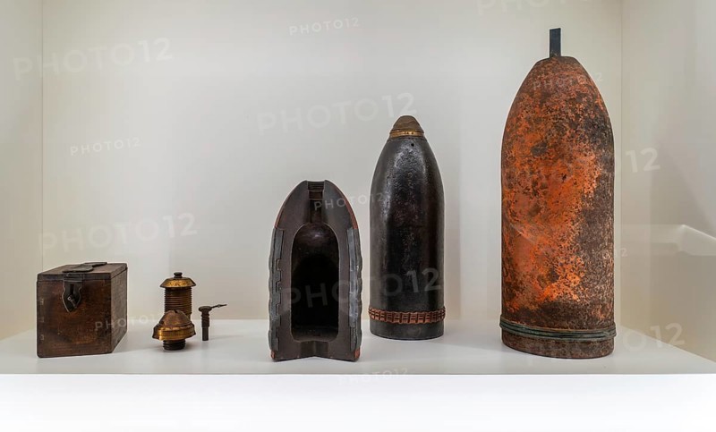 WW1 artillery shells, fuzes and sectioned projectile on display in museum at Fort van Liezele near Puurs-Sint-Amands, province Antwerp, Belgium, Europe