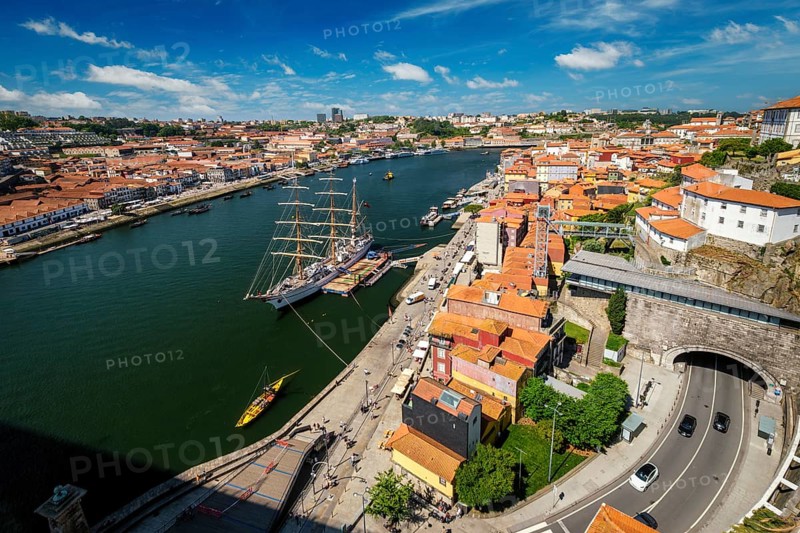 Aerial view of Porto city and Vila Nova de Gaia and Douro river with moored sailling ship from Dom Luis bridge I. Porto, Portugal, Europe