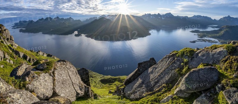 Panorama, view of Fjord Raftsund and mountains in the evening light, sun star, view from the summit of Dronningsvarden or Stortinden, Vesterålen, Norway, Europe