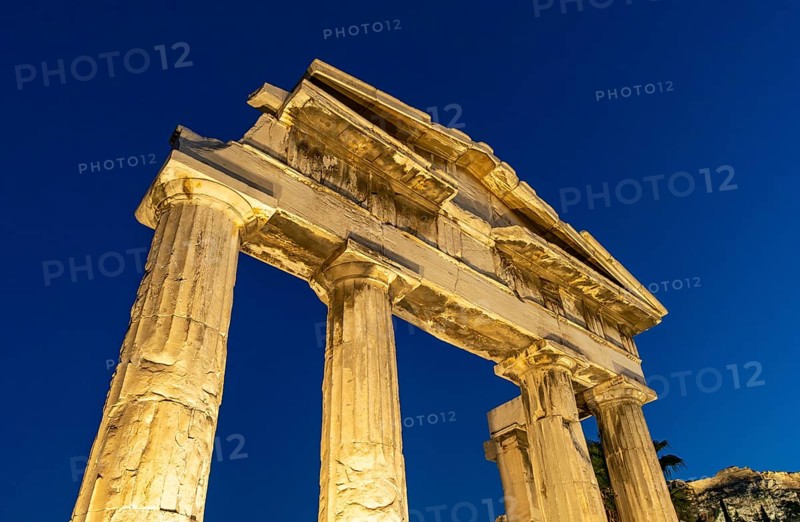 Gate of Athena Archegetis illuminated against the blue night sky, Roman Agora, Athens, Greece, Europe