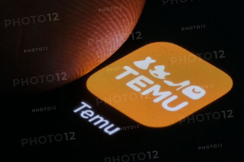 The logo of the Temu app (online marketplace) from Chinese company PDD Holdings can be seen next to a finger. Berlin, 27.03.2024