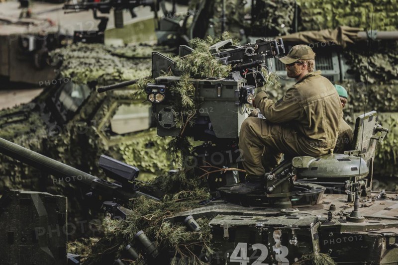 A soldier sits on a tank, taken as part of a Bundeswehr exercise with armed forces from Norway and the Czech Republic during the 'Wettiner Schwert' exercise as part of Quadriga 2024 in the training town of Schnöggersburg, 8 April 2024