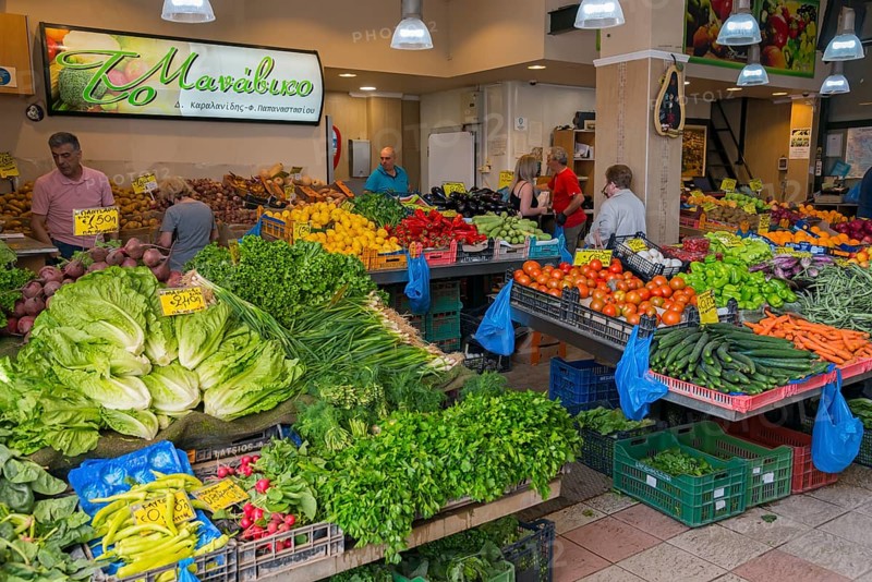 Lively vegetable market with a variety of fresh produce and people shopping, market hall, Xanthi, Eastern Macedonia and Thrace, Greece, Europe