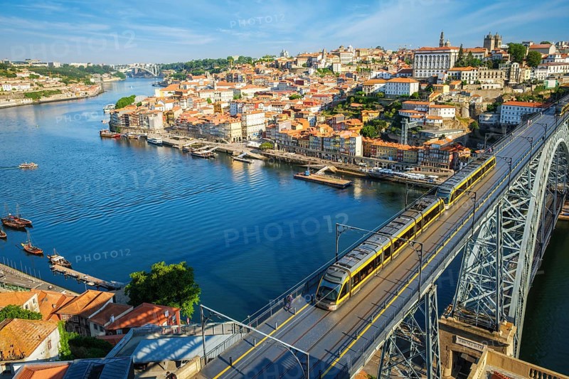 View of Porto city and Douro river and Dom Luis bridge I with metro tram from famous tourist viewpoint Miradouro da Serra do Pilar. Porto, Vila Nova de Gaia, Portugal, Europe
