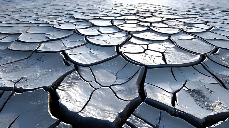 Aerial perspective of a salt and clay pan revealing the intricate patterns of its broken surface, AI generated