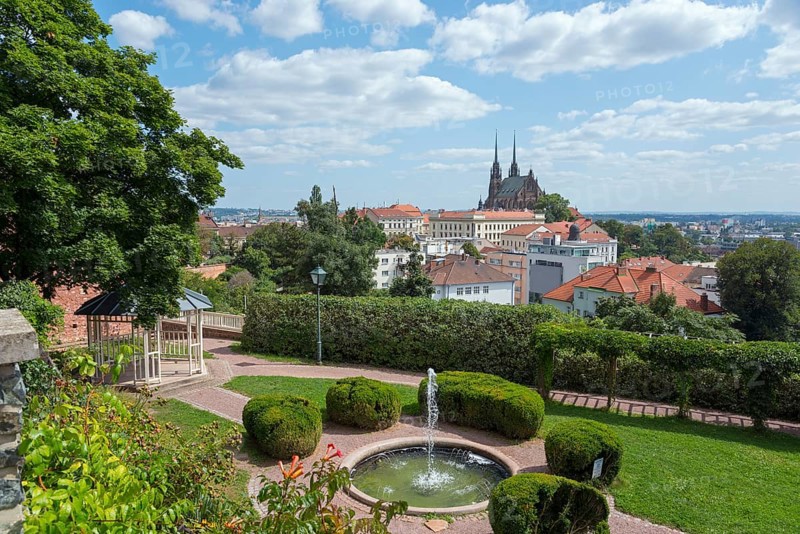 View of a cathedral surrounded by residential buildings and green areas on a sunny day, view from Spielberg Park to the old town centre with the Gothic Catholic Cathedral of St. Peter and Paul, Brno, Brno, Jihomoravský kraj, Moravia, Czech Republic, Europe